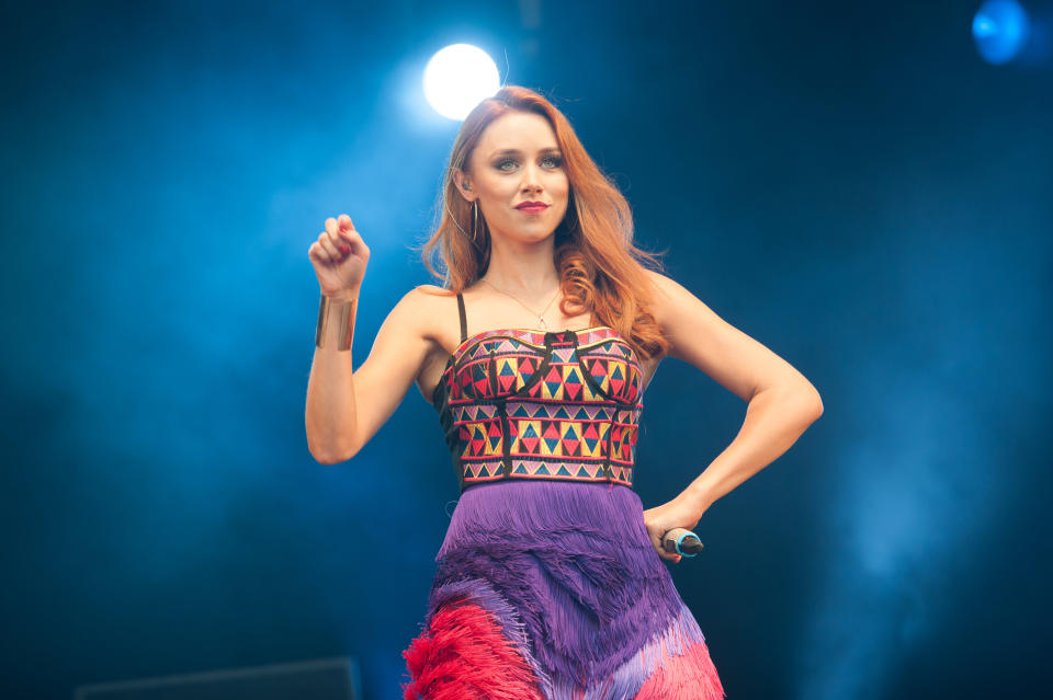 BIRMINGHAM, UNITED KINGDOM - SEPTEMBER 01: Una Healy of The Saturdays performs on stage on Day 2 of Fusion Festival 2013 at Cofton Park on September 1, 2013 in Birmingham, England. (Photo by Ollie Millington/Redferns via Getty Images)