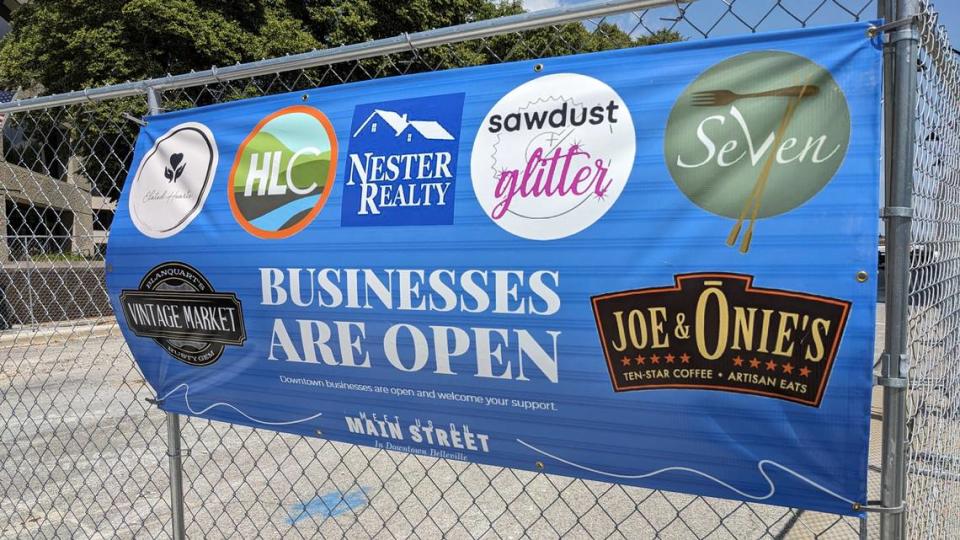 Banners posted on the barricades around downtown Belleville&#x002019;s Public Square let customers know the businesses are open.