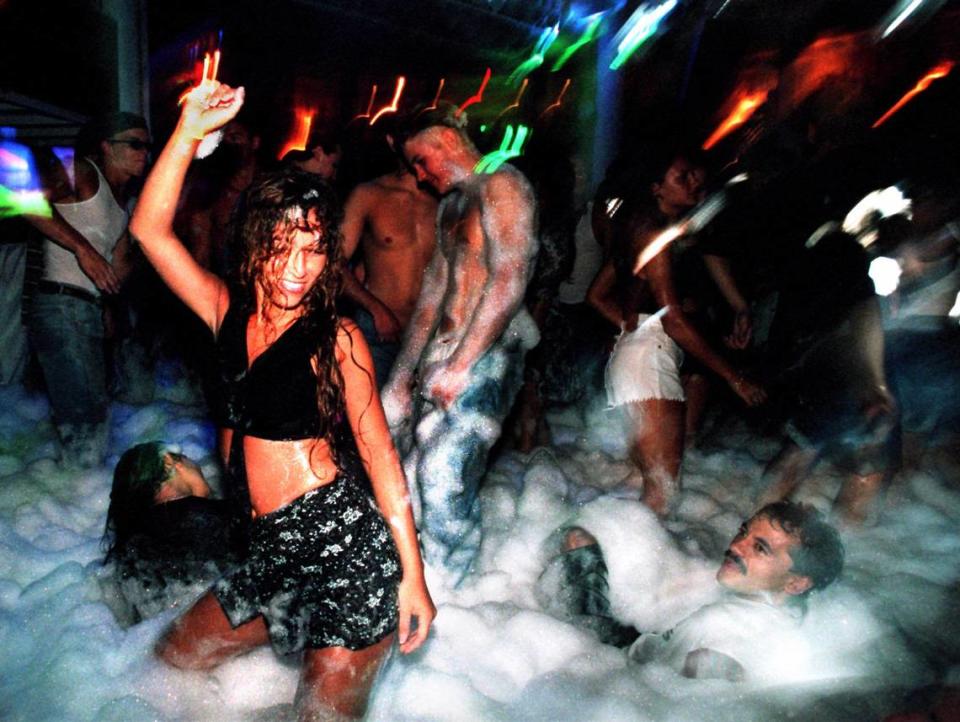 Club goers dance during one of the famed foam parties at the open-air club Amnesia, 136 Collins Ave., on July 14, 1995.