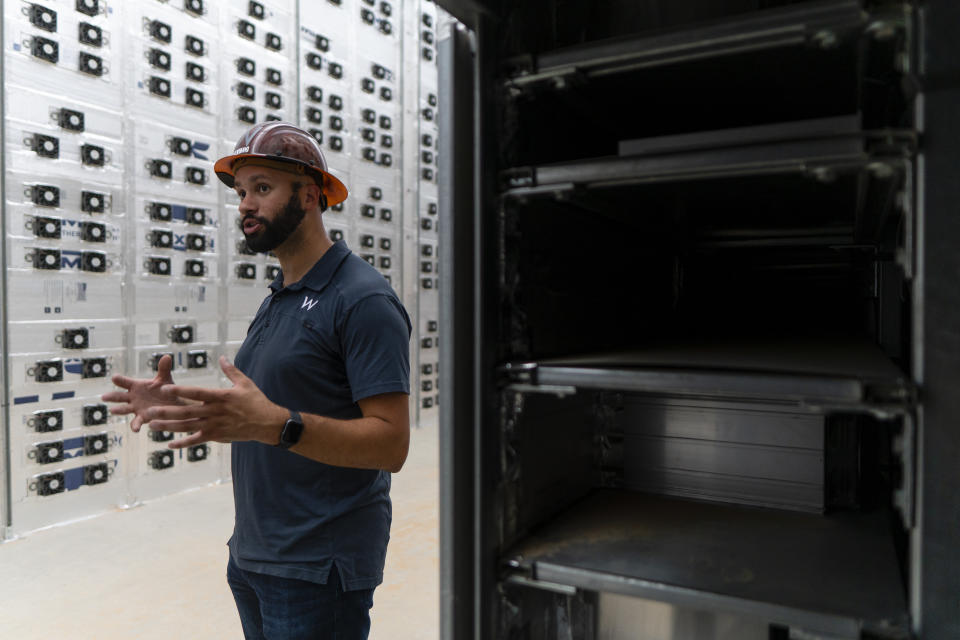 ROCKDALE, TX - JUNE 23: David Schatz, Vice President of Operations for Whinstone, a cryptocurrency mining company recently acquired by Riot Blockchain, explains how miners work at a Riot Blockchain facility in Rockdale, TX, on June 23, 2021. Riot Blockchain, a Bitcoin mining company that hosts Bitcoin mining equipment for clients, houses the largest Bitcoin mining facility in the U.S. in Rockdale, TX.