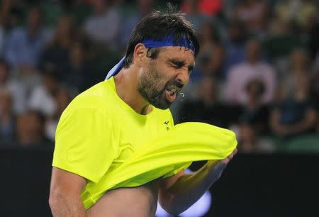 Tennis - Australian Open - Melbourne Park, Melbourne, Australia - 19/1/17 Cyprus' Marcos Baghdatis reacts after losing a point during his Men's singles second round match against Spain's Rafael Nadal. REUTERS/Jason Reed