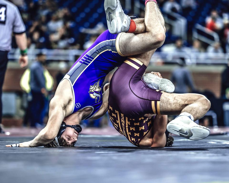 Bronson's Carson Norton works the legs this past weekend at the MHSAA State Wrestling Finals. Norton took fourth place at 157 pounds