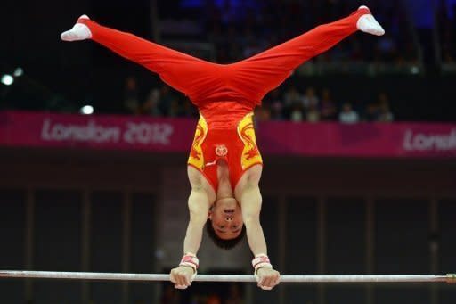 China's gymnast Zou Kai competes on the horizontal bar during the men's qualification of the artistic gymnastics event of the London Olympic Games on July 28