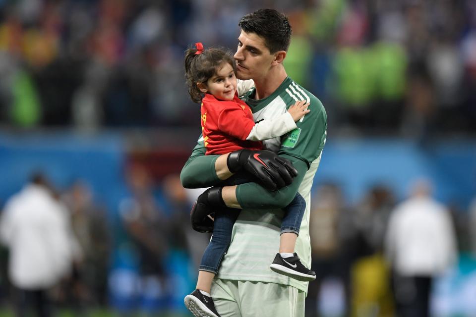 <p>Belgium’s goalkeeper Thibaut Courtois carries his daughter, Adriana, as he greets the fans after their defeat in the Russia 2018 World Cup semi-final football match between France and Belgium at the Saint Petersburg Stadium in Saint Petersburg on July 10, 2018. – France reached the World Cup final on Tuesday after a second-half header from Samuel Umtiti gave them a 1-0 win against Belgium. (Photo by GABRIEL BOUYS / AFP) </p>