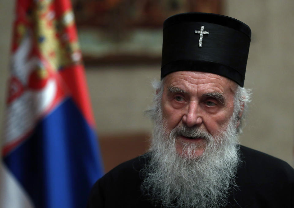 FILE -In this file photo taken Sunday, March 15, 2020, Serbian Patriarch Irinej speaks during a statement with Serbian President Aleksandar Vucic in Belgrade, Serbia. The patriarch of the Serbian Orthodox Church has been hospitalized after testing positive for the new coronavirus. The diagnosis comes days after he led prayers at the large public funeral for the head of the church in Montenegro, who died after contracting the virus. The Serbian church announced late Wednesday, Nov. 4, 2020 that the 90-year-old Patriarch Irinej was hospitalized but has no symptoms and is in “excellent general condition.” (AP Photo/Darko Vojinovic, File)