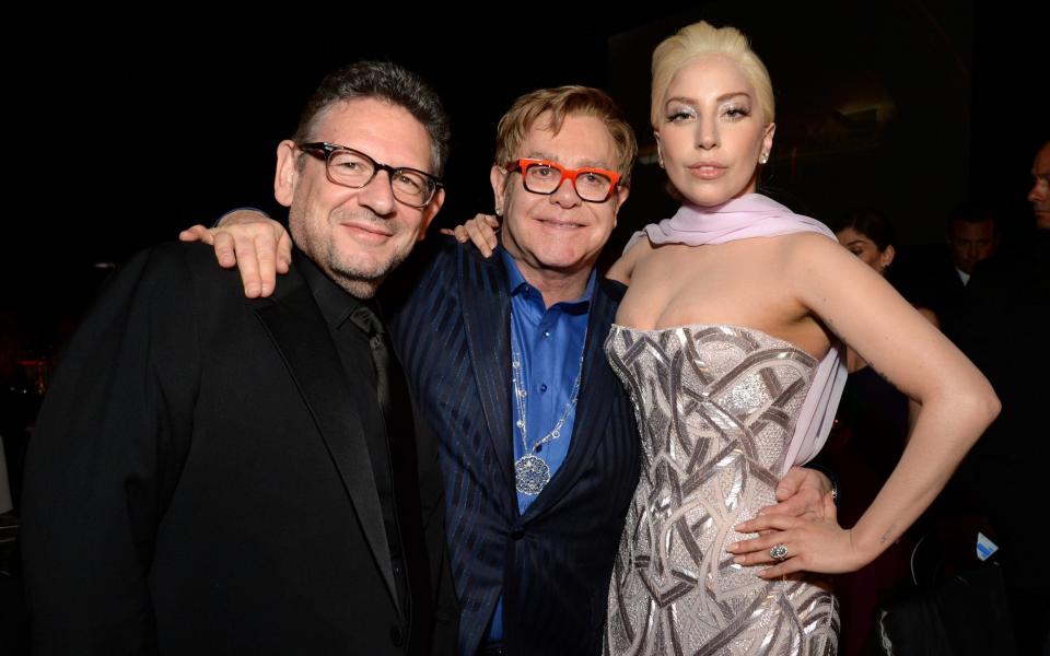 WEST HOLLYWOOD, CA - MARCH 02: (L-R) Musical Artist Lucian Grainge, recording artist Sir Elton John and singer Lady Gaga attend the 22nd Annual Elton John AIDS Foundation Academy Awards Viewing Party at The City of West Hollywood Park on March 2, 2014 in West Hollywood, California. (Photo by Michael Kovac/Getty Images for EJAF) - Michael Kovac/Getty Images