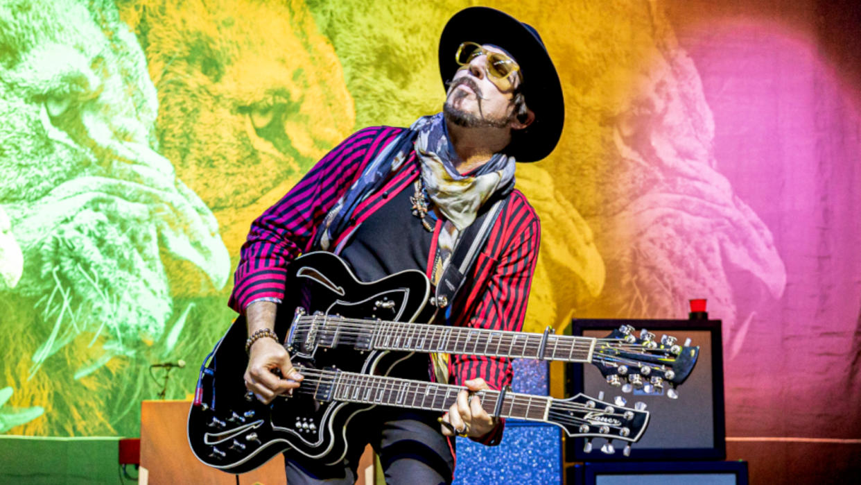  Holiday plays his  custom semi-hollow  Kauer Super Chief  double-neck 12-/ six-string, at the  Fillmore in Detroit,  October 27, 2021.  