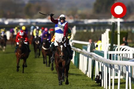 Britain Horse Racing - Grand National Festival - Aintree Racecourse - 8/4/17 Derek Fox on One For Arthur celebrates as he wins the 5:15 Randox Health Grand National Action Images via Reuters / Jason Cairnduff Livepic