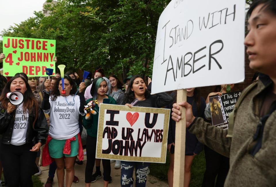 Supporters of Johnny Depp and Amber Heard line the street outside the courthouse in Fairfax on Friday (REUTERS)