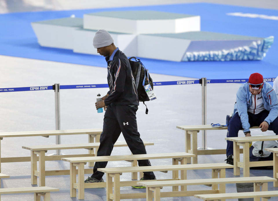 Shani Davis of the U.S. leaves the arena after the men's 1,500-meter speedskating race at the Adler Arena Skating Center during the 2014 Winter Olympics in in Sochi, Russia, Saturday, Feb. 15, 2014. (AP Photo/David Goldman)