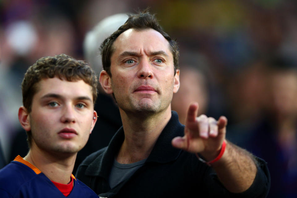 BARCELONA, SPAIN - APRIL 02:  Actor Jude Law takes his seat next to his son Rafferty Law before the start of the La Liga match between FC Barcelona and Real Madrid CF at Camp Nou on April 2, 2016 in Barcelona, Spain.  (Photo by Paul Gilham/Getty Images)