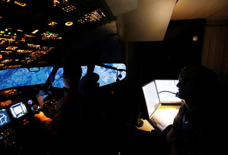 An aviation student of Lion Air Group learns to fly away while a senior instructor supervises in Boeing 737-900ER simulator during a Jet Introduction session at Angkasa Training Center near Jakarta, Indonesia, November 2, 2018. REUTERS/Willy Kurniawan