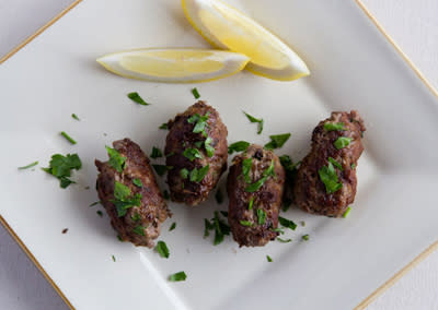 <div class="caption-credit"> Photo by: Photo by Kimberley Hasselbrink</div><b>Kofte Meatballs</b> <br> <br> Combine ground beef with grated garlic, beaten egg, grated lemon zest, finely chopped parsley, and ground cumin and cinnamon. Shape into 1-inch-wide cylindrical meatballs. Dust with flour, then pan-fry in vegetable oil until browned and cooked through, about 6 minutes. Squirt immediately with lemon juice.