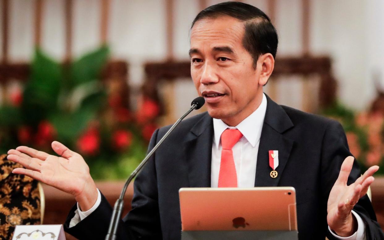 Rights groups have urged Indonesian President Joko Widodo to delay the controversial bill - REX