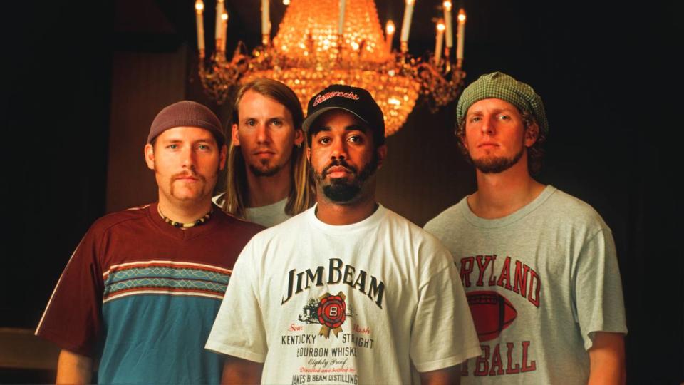 <em>Rucker, center, with his Hootie & the Blowfish bandmates, from left, Mark Bryan, Dean Felber, and Jim Sonefeld</em>.