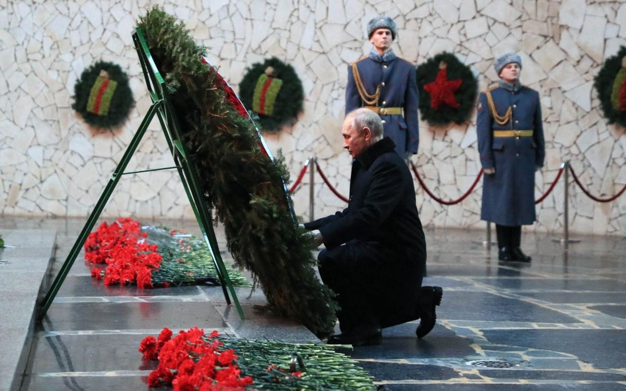 Vladimir Putin lays a wreath to the Eternal Flame in Volgograd, renamed Stalingrad for the day - Dmitry Lobakin/AFP