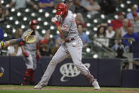 Cincinnati Reds' Tyler Stephenson is hit by a pitch during the 10th inning of the team's baseball game against the Milwaukee Brewers on Tuesday, June 15, 2021, in Milwaukee. (AP Photo/Jeffrey Phelps)