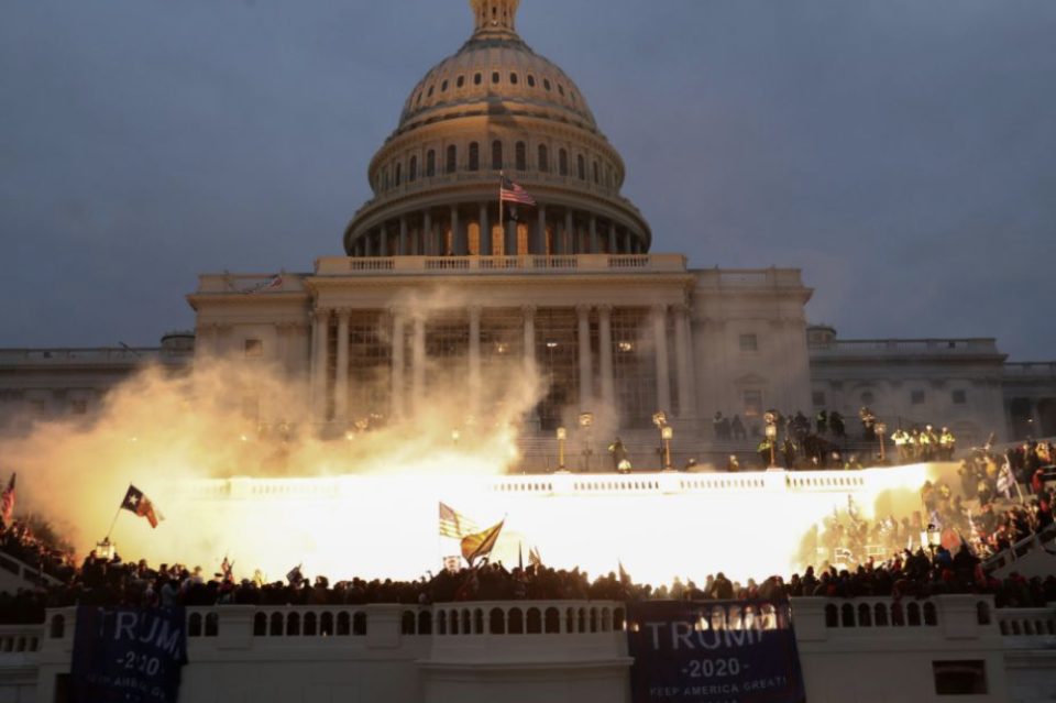 A dramatic explosion is caught on camera outside of the Capitol building amid pro-Trump riots. (Reuters)