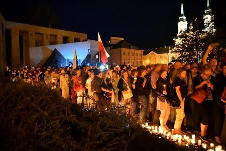 Protesters gather during a candlelight rally to protest against judicial reforms in front of the Supreme Court in Warsaw, Poland, July 16, 2017. Agencja Gazeta/Franciszek Mazur via REUTERS