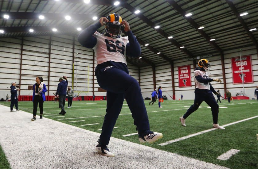 Rams defensive tackle Sebastian Joseph-Day stretches during a Super Bowl LIII practice session on Jan. 30, 2019.