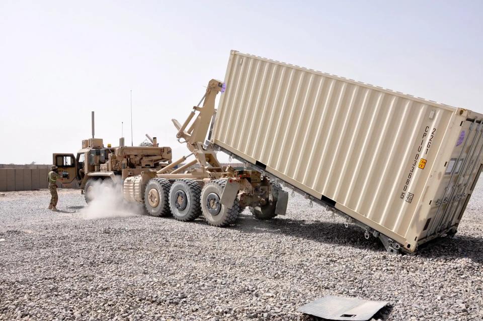 Any truck capable of carrying standard ISO shipping containers, such as the US Army M1074 Palletized Load System (PLS) truck seen here, could carry Rheinmetall's launcher system. <em>US Army</em>