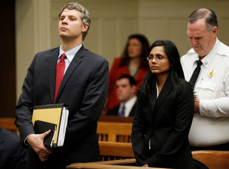 FILE PHOTO: Annie Dookhan, a former chemist at the Hinton State Laboratory Institute, stands beside her lawyer Nick Gordon (L) during her arraignment at Brockton Superior Court in Brockton, Massachusetts January 30, 2013. REUTERS/Jessica Rinaldi/File Photo
