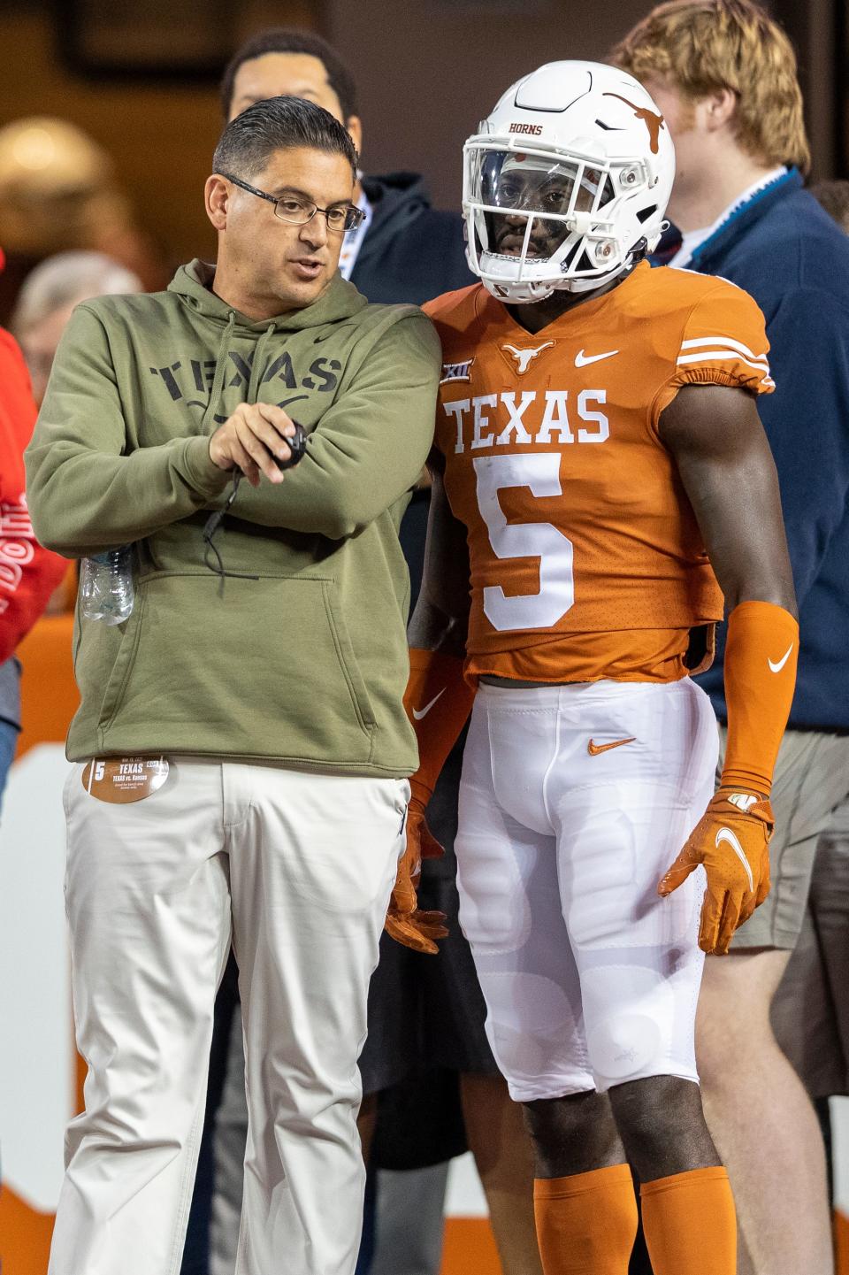 Texas special teams coordinator Jeff Banks talks with defensive back D'Shawn Jamison during a game last season. Banks is having to replace Cameron Dicker, who handled kicking and punting duties last year. "What we have to do, right, is we have to evaluate the kicking and the punting positions with these guys in the next probably 15 and 20 days," Banks said.