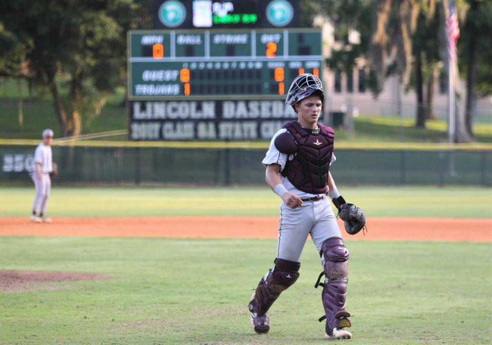 Chiles catcher Garrett Greene heads back to home plate after a discussion on the mound as Lincoln baseball beat Chiles 5-4  in 10 innings during a District 2-8A championship game on Thursday, May 9, 2019.