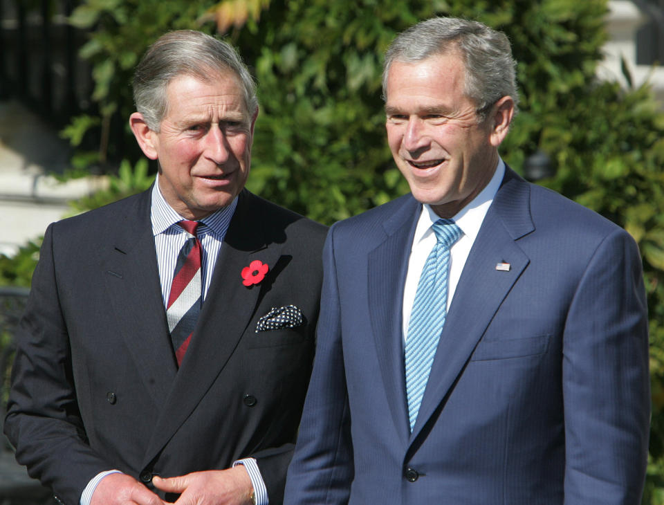 FILE - President George W. Bush, right, greets Britain's Prince Charles on Nov. 2, 2005, on the South Portico of the White House in Washington. (AP Photo/Ron Edmonds, File)