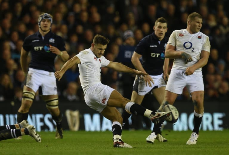 England's scrum half Danny Care kicks past England's captain and hooker Dylan Hartley (R) during the Six Nations international rugby union match in Edinburgh, Scotland on Febuary 6, 2016