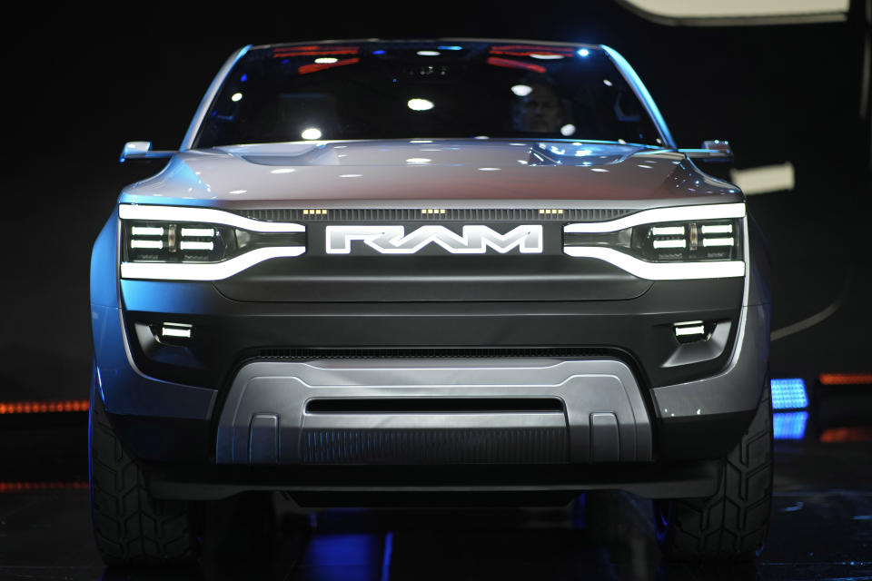 The Ram 1500 Revolution electric battery powered pickup truck is displayed on stage during the Stellantis keynote at the CES tech show Thursday, Jan. 5, 2023, in Las Vegas. (AP Photo/John Locher)