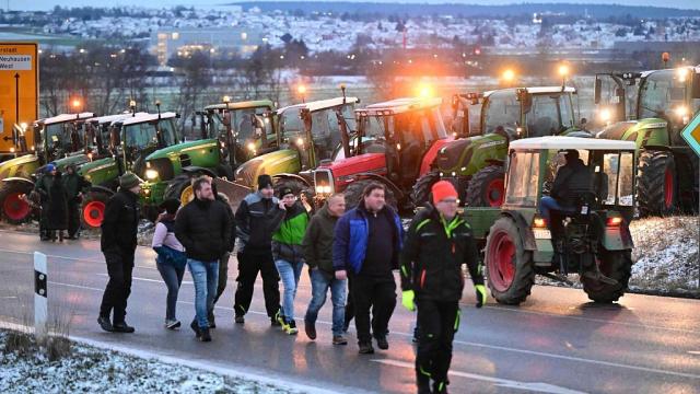 German farmers block major highways with tractors in protest against plans to scrap diesel tax break