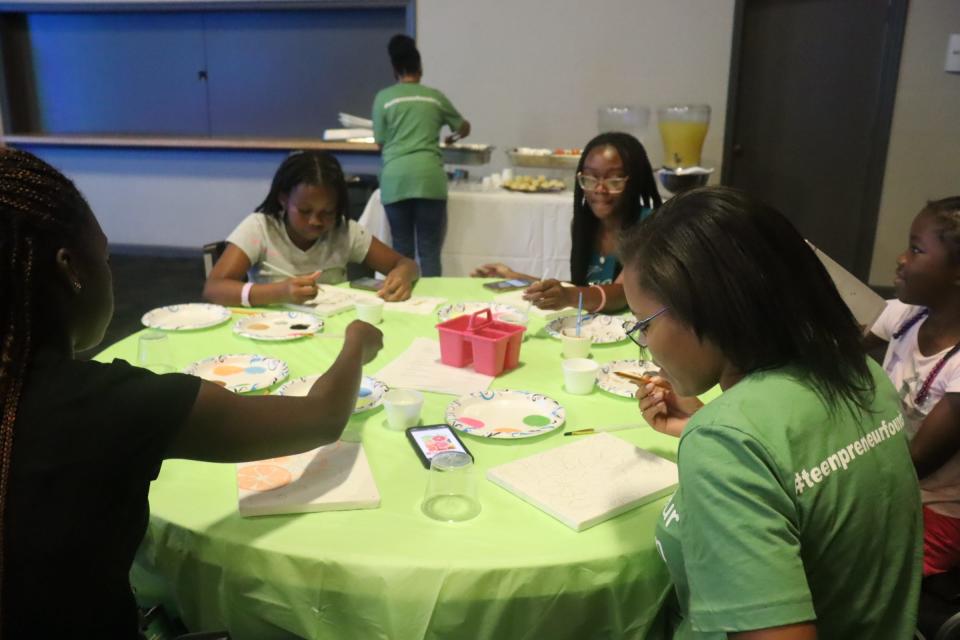 Students work on projects at Teenpreneur day camp.