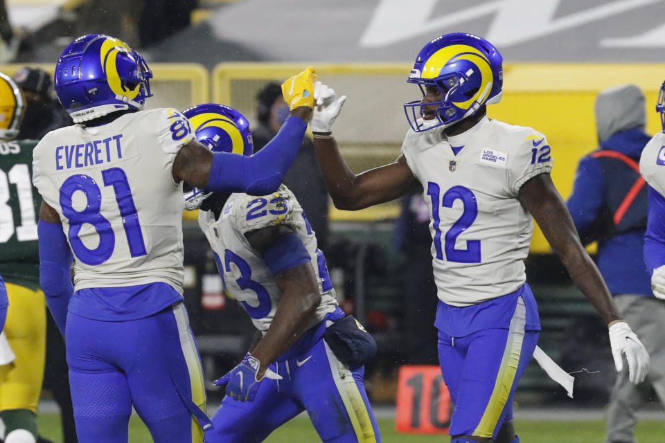Los Angeles Rams' Van Jefferson (12) celebrates his touchdown catch with Gerald Everett during the first half of an NFL divisional playoff football game against the Green Bay Packers, Saturday, Jan. 16, 2021, in Green Bay, Wis. (AP Photo/Mike Roemer)