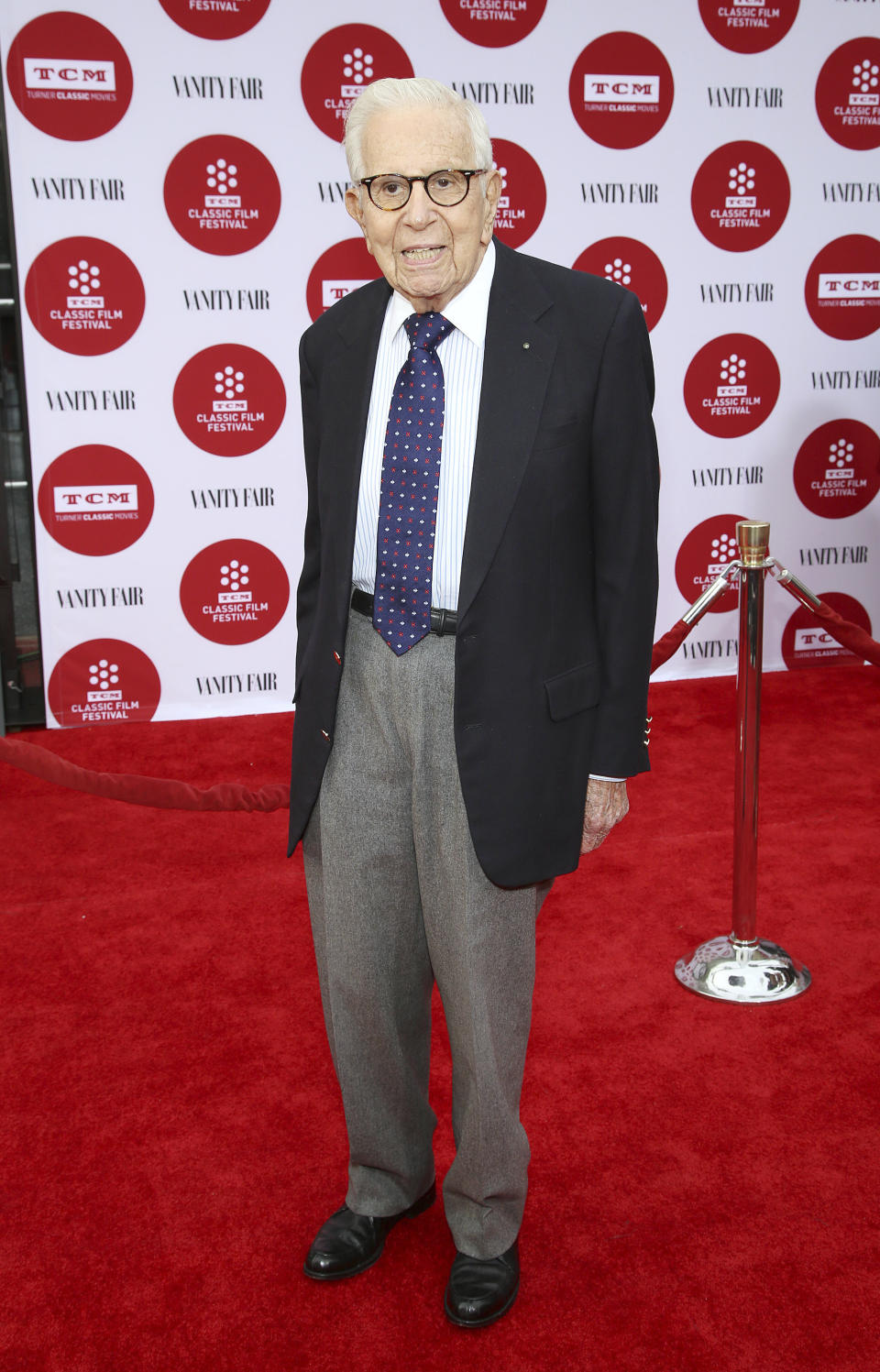 FILE - Walter Mirisch arrives at 2014 TCM Classic Film Festival's Opening Night Gala at the TCL Chinese Theatre on April 10, 2014, in Los Angeles. Mirisch, the astute and Oscar winning film producer who oversaw such classics as “Some Like It Hot,” “West Side Story” and “In the Heat of the Night,” has died of natural causes, the Academy of Motion Picture Arts and Sciences said Saturday, Feb. 25, 2023. He was 101. (Photo by Annie I. Bang/Invision/AP, File)