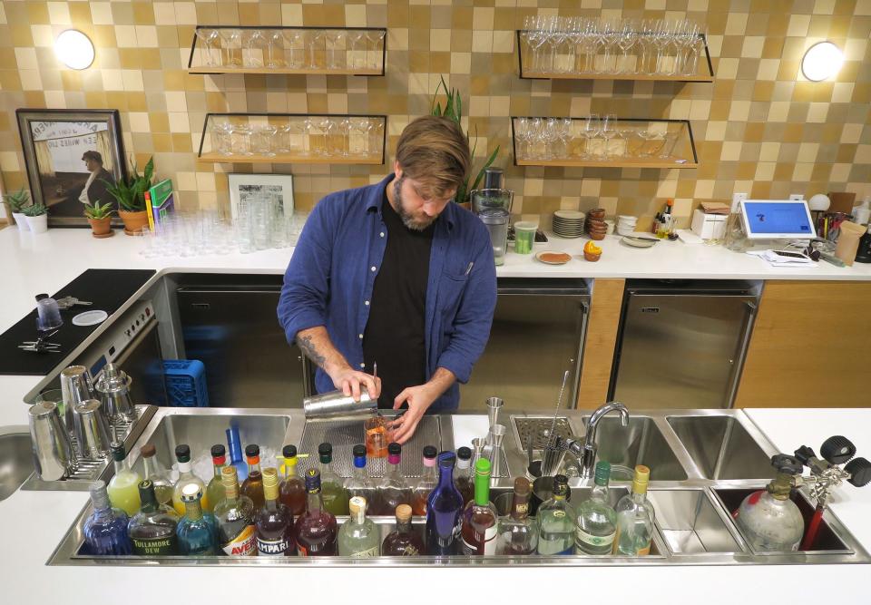 Ricardo Rodriguez prepares a cocktail at the La Otra.