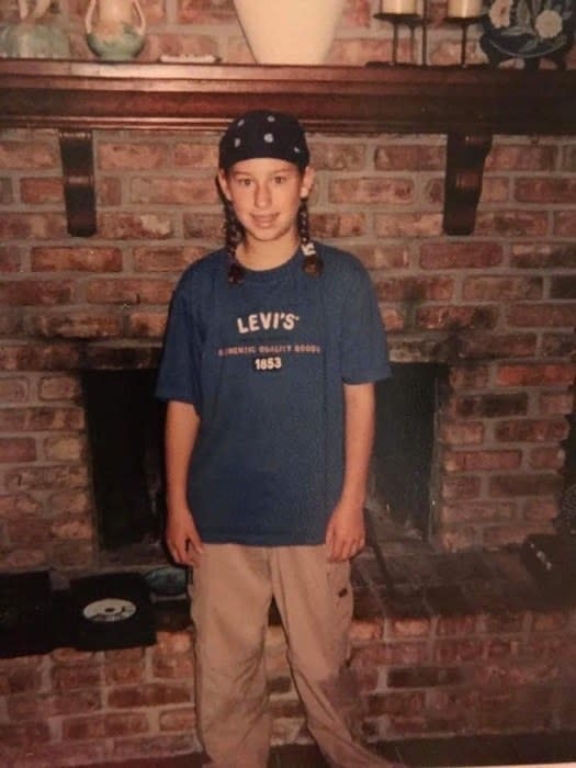 young girl in baggy pants and long shirt