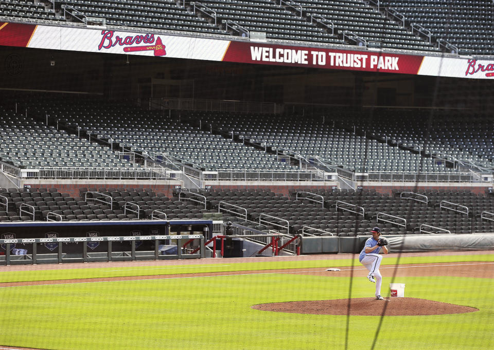 Atlanta Braves pitcher Cole Hamels appears to have Truist Park to himself while working from the mound during baseball practice, Friday July 3, 2020 in Atlanta. (Curtis Compton/Atlanta Journal-Constitution via AP)