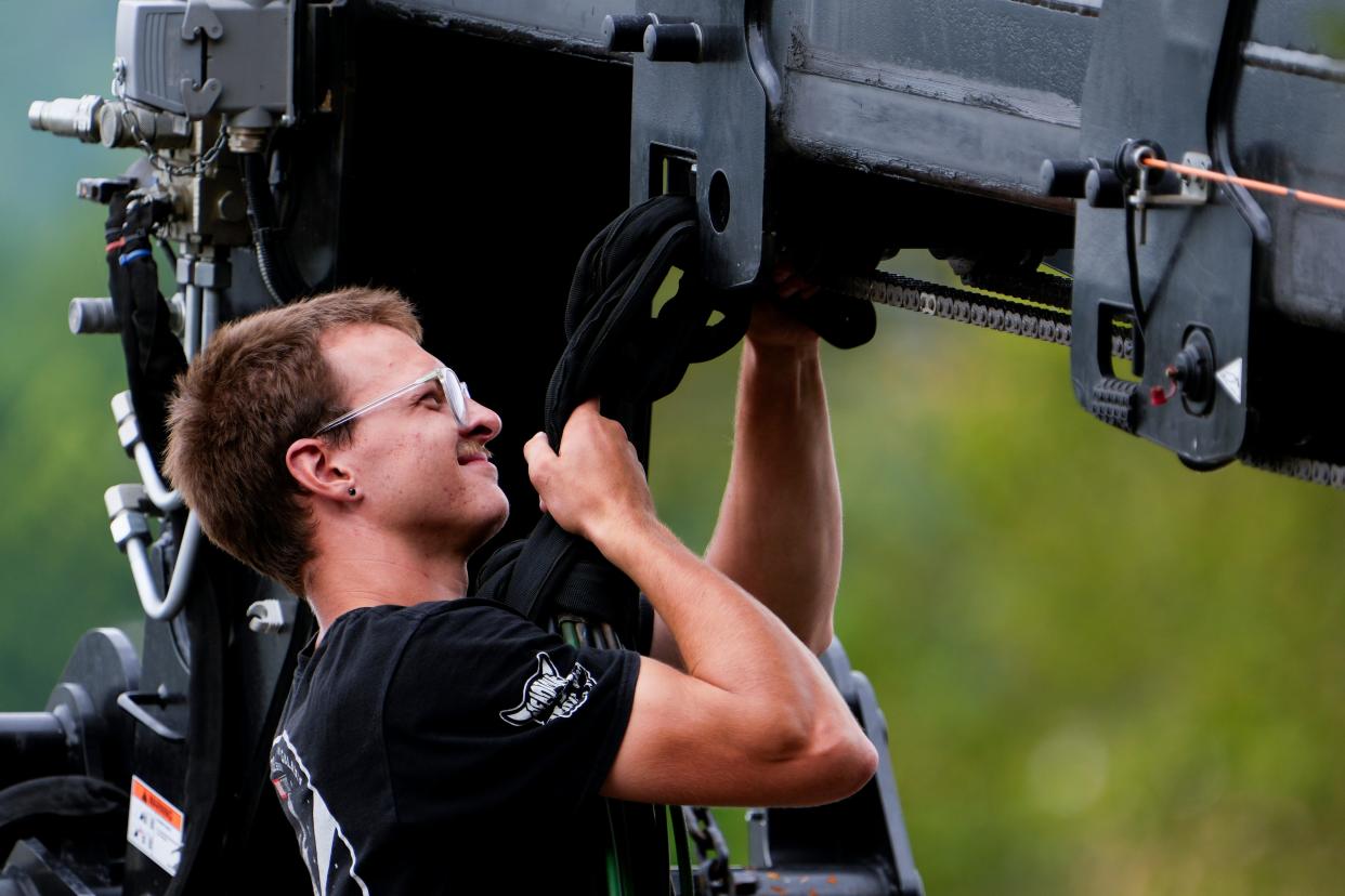 A production crew member helps build the set for the filming of what appeared to be “Superman" at Cincinnati Museum Center in July.