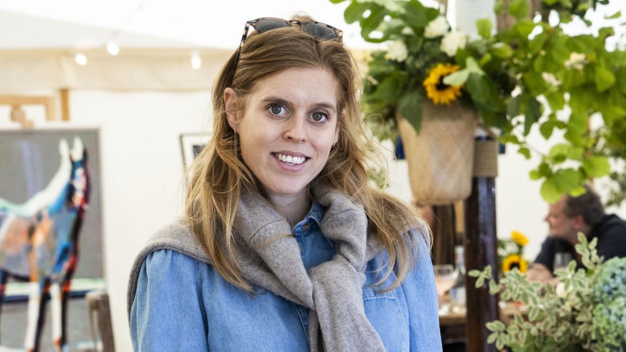 Beatrice wearing denim shirt and beige skirt at Cornbury House Horse Trials