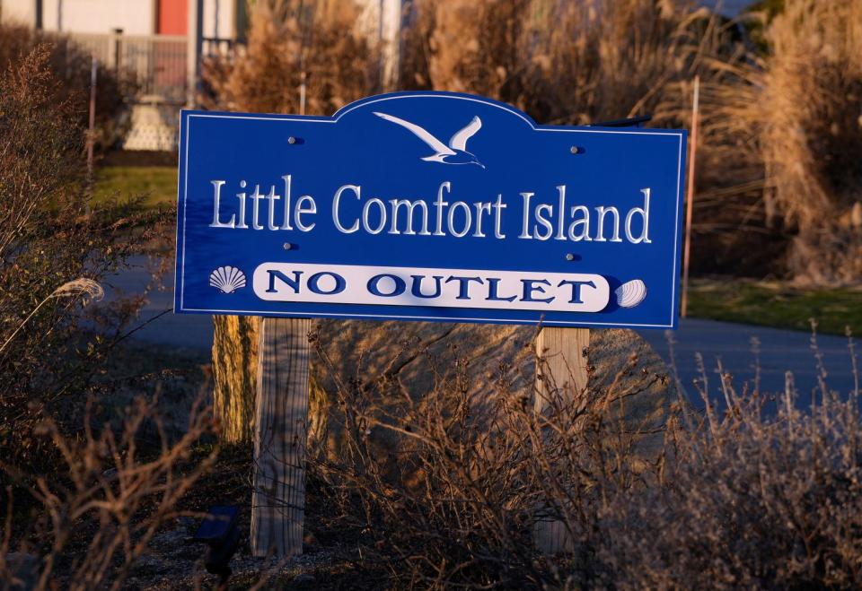 A sign identifies Little Comfort Island. Point Judith Pond Oyster Farm faces a lawsuit from people living on nearby Edith Road in Narragansett.
