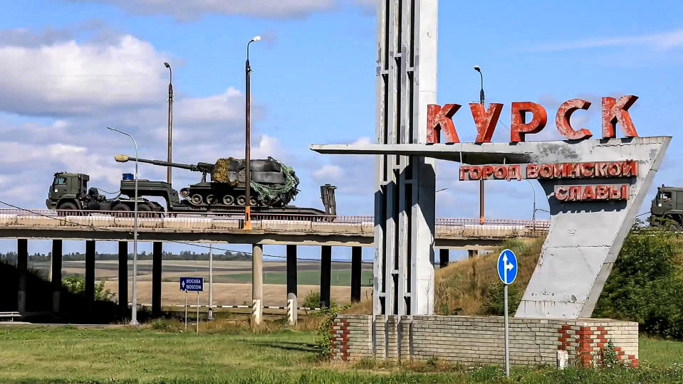 In this photo taken from video released by the Russian Defense Ministry on Friday, Aug. 9, 2024, a column of the Russian Armed Forces move to build up forces conducting active combat operations with Ukrainian formations in the Sudzhansky district of Kursk region of Russia. (Russian Defense Ministry Press Service via AP)