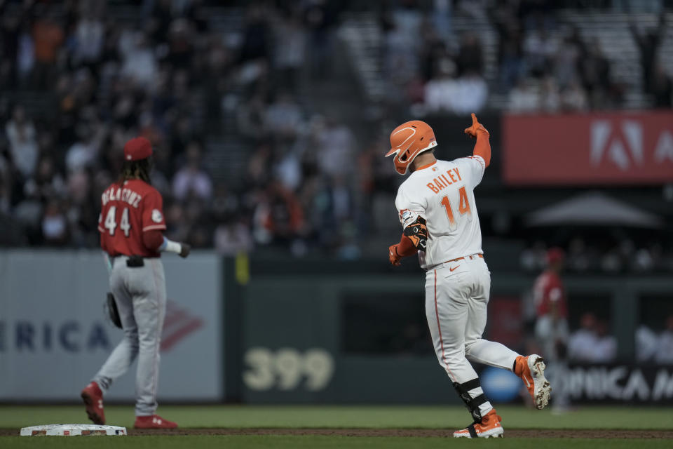 San Francisco Giants' Patrick Bailey, right, runs the bases after hitting a two-run home run against the Cincinnati Reds during the third inning of a baseball game Tuesday, Aug. 29, 2023, in San Francisco. (AP Photo/Godofredo A. Vásquez)