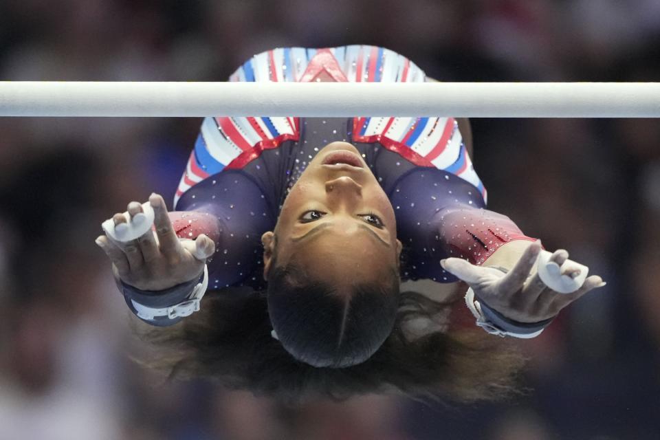 Shilese Jones competes on the uneven bars at the United States Gymnastics Olympic Trials on Friday, June 28, 2024 in Minneapolis. (AP Photo/Charlie Riedel)