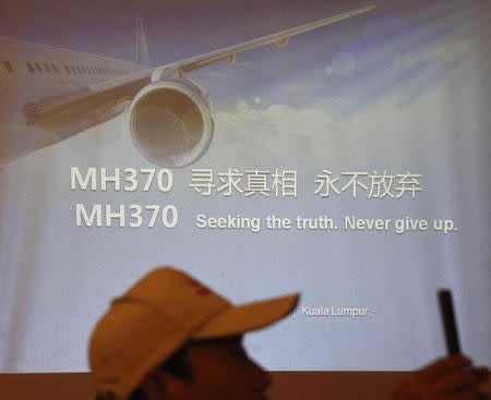 Relatives of some of the Chinese passengers who were on board the missing Malaysia Airlines flight MH370 outline their demands to the airline at a news conference in Kuala Lumpur February 20, 2015. REUTERS/Olivia Harris