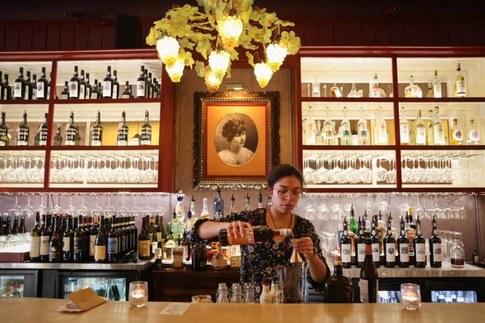 Caitlin Britt mixes a drink at the Lula Drake Wine Parlour in Columbia on Tuesday, March 26, 2024. The Lula Drake Wine Parlour is a semifinalist for a 2024 James Beard Award.