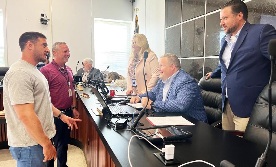 Carter Owens, left foreground, on-scene coordinator for the U.S. Environmental Protection Agency Region 4 for the Superfund and Emergency Management Division, and Steve Seeger, deputy director of TDEC’s Division of Radiological Health, talk with County Commissioners Shelly Vandagriff, Tyler Mayes, and Intergovernmental Committee Chairman Aaron Wells, after Monday morning’s Intergovernmental Committee meeting. Owens provided a status update regarding cleanup work at the former American Nuclear Corp. site.