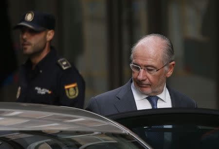 Rodrigo Rato leaves the High Court after being questioned by a judge investigating the alleged use of Caja Madrid credit cards for personal expenses in Madrid October 16, 2014. REUTERS/Susana Vera