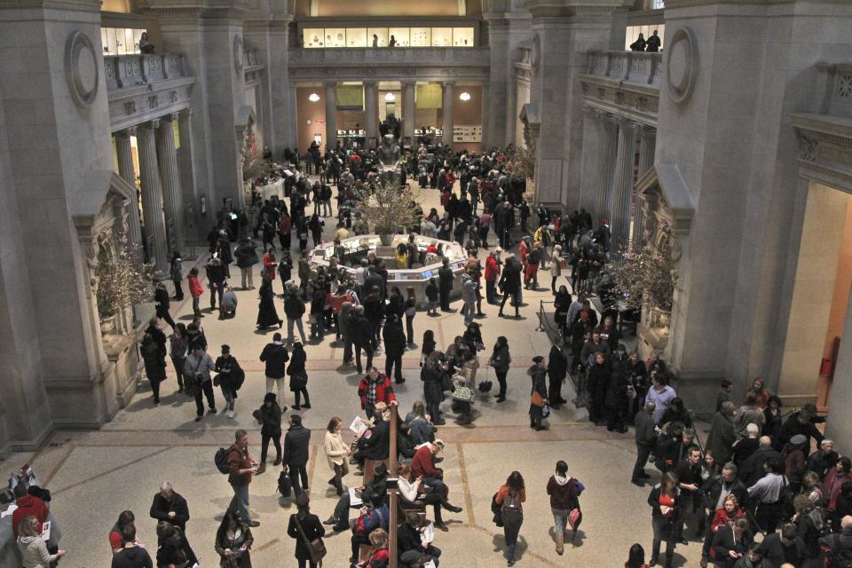 In this Tuesday, March 19, 2013 photo visitors to the Metropolitan Museum of Art in New York congregate in the main lobby. (AP Photo/Mary Altaffer)