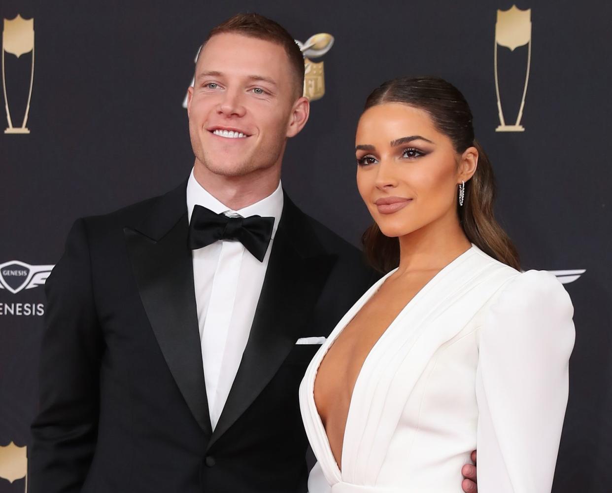 Christian McCaffrey and Olivia Culpo pose on the Red Carpet poses prior to the NFL Honors on February 1, 2020 at the Adrienne Arsht Center in Miami, FL